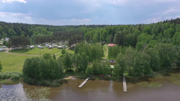 Amazing Aerial Shot of a Trailer Park Next to a Lake alt