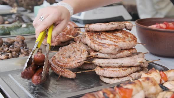 Ready-to-Eat Grilled Meat in a Street Food Shop Window. Ready-made Food on Party alt