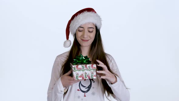 Young woman Opens Christmas Gift and Surprised (White Screen) alt
