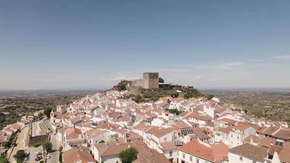 Aerial orbiting over Castelo de vide white houses village, hilltop Castle - Alentejo alt