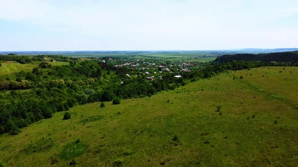 Aerial drone view of a flying over the rural agricultural landscape. alt