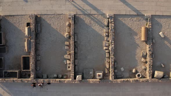 Roman Forum Historical Landmark At Dusk With Locals Walking During Sunset In Zadar, Croatia. - aeria alt