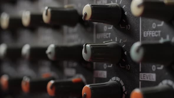 Old dusty audio console closeup. Changing lighting. alt