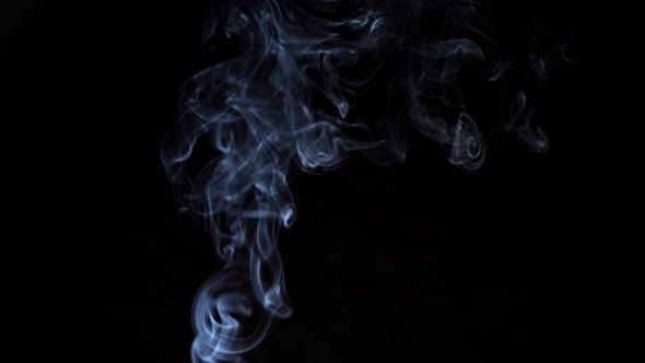 Dangerous Smoke Rises From Unextinguished Candle in Room alt