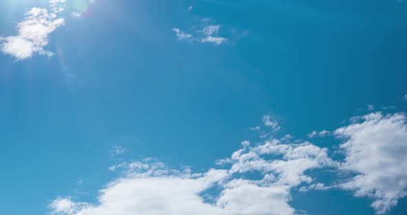 Blue Sky with White Clouds Floating on Windy Day alt