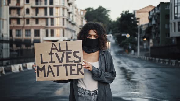 Africanamerican Woman in Black Bandana on Face alt