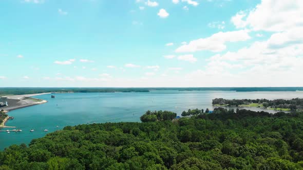 Aerial drone footage of the dam and the lake in Lake Murray, South Carolina. alt