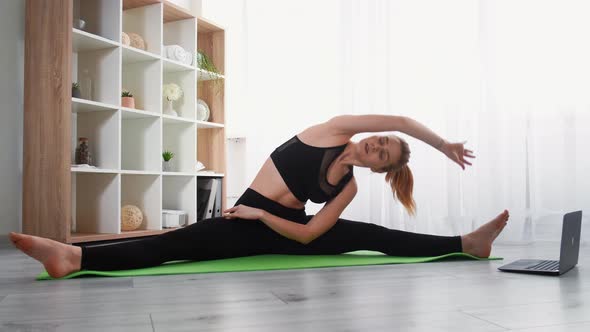 Sport at Home Internet Workout Woman Stretching alt