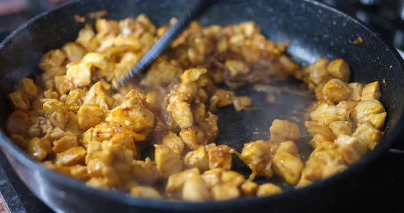 Chopped Chicken Fillet Fried in Pan Closeup