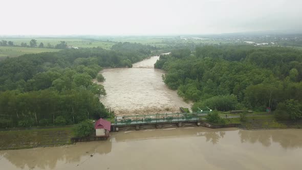 Aerial View of the Dam During Floods. Extremely High Water Level in the River.