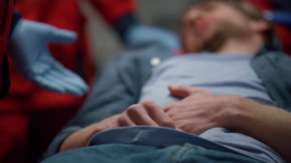 Patient Lying on Stretchers in Ambulance Car alt