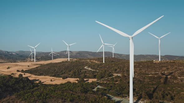 Windmills Turbines Rotate Green Alternative Energy Generation in Desert Wild Nature Landscape