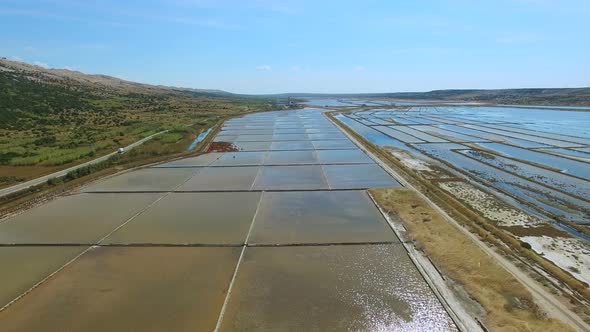 Flying above salt evaporation ponds on Pag island, Croatia alt