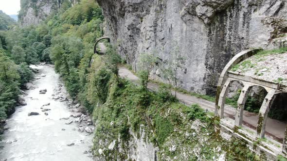 Aerial view of old abandoned road to Krasnaya Polyana in Sochi. Russia. alt