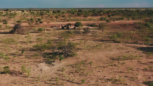 A remote African village with homes made from mud and grass. Zambia, Africa. 4K alt