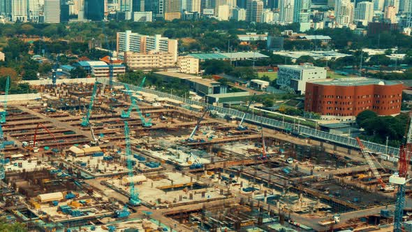Time lapse cityscape and construction site in metropolis panoramic view alt