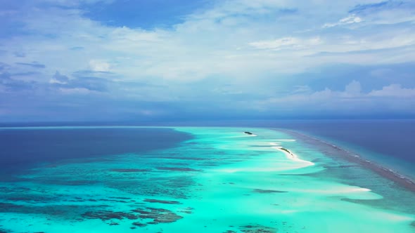 Aerial top down seascape of exotic resort beach time by aqua blue lagoon and white sandy background  alt