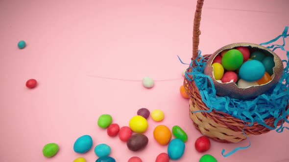 Easter Egg with Colorful Candies in a Basket Close Up