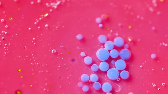 Bright Collors Bubbles Slow Motion Oil Ink. Pink and blue Bubblegum flavor background. alt