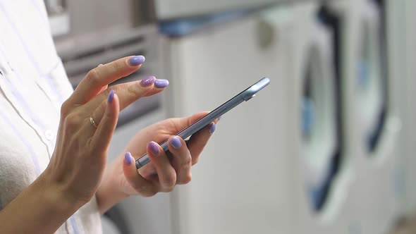 Closeup of a Woman s Hands Holding a Smartphone