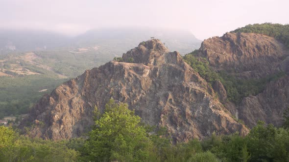 Mysterious north Italian Rock Stone Face looks like a bearded man sleep during sunrise 