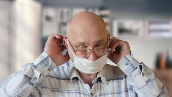 Elderly Man Dressing Up Protective Mask