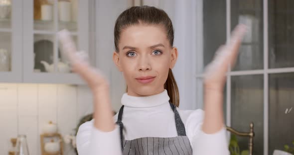 Professional Woman Chef Clapping Her Hands Filled White Flour Kitchen Close Up Slow Motion alt