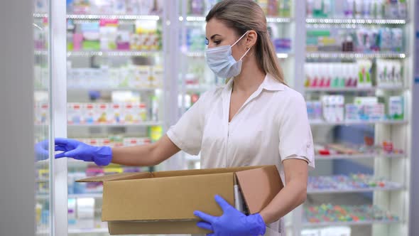 Tired Caucasian Female Pharmacist Putting Bottles with Pills on Shelf in Drugstore Taking Off alt