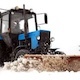 Tractor Plowing Snow Passing By in the City Courtyard 3