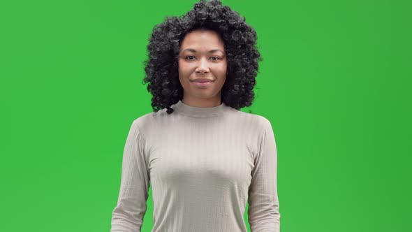 Green Screen Young African Female Showing Love Sign