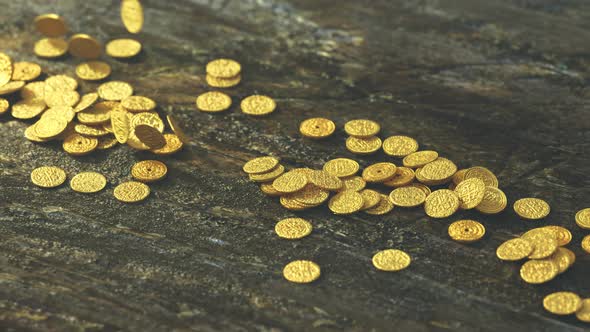 Old gold coins falling on the rough wooden table. Ancient treasure, wealth. alt