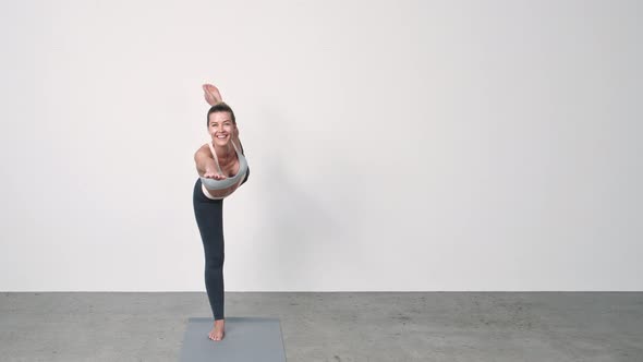 Woman Performing Yoga Dancers Pose