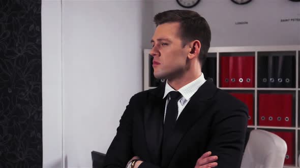 Portrait of Successful Man Turning Head Looking Into the Camera alt