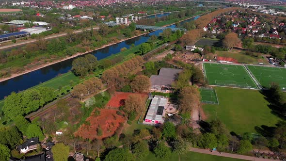 Top view of the embankment of the Neckar River. Bridges, green grass and trees. Mannheim. Germany. alt