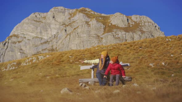 Family of Tourists Visits the Sedlo Pass Bobov Kuk in the Mountains of the Northern Montenegro alt