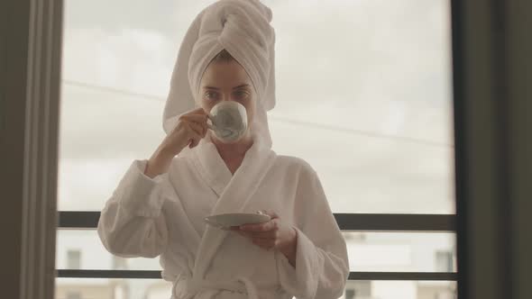 Young Woman Enjoying Morning Coffee alt