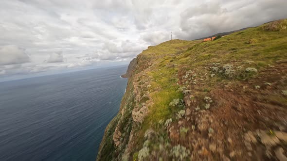 FPV Racing Drone Mountain Surfing and Cliff Diving Along the Rocks alt