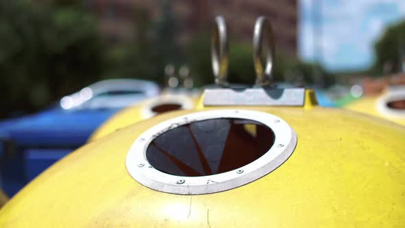 Man throwing away plastic, disposable mug into recycling bin alt