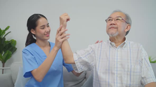 Asian nurse checkup and recovery grandfather arm, shoulder and joint from pain
