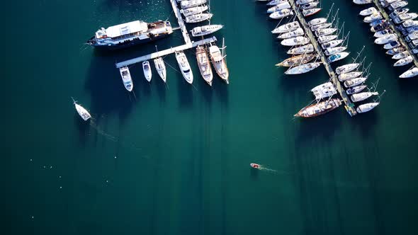 View from drone on full of yachts Bodrum harbour and ancient Kalesi castle in Mugla in Turkey alt