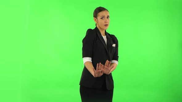 Woman Strictly Gesturing with Hands Shape Meaning Denial Saying NO. Green Screen alt