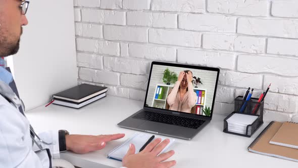 Nervous panic attack woman in computer screen talk online with medical worker