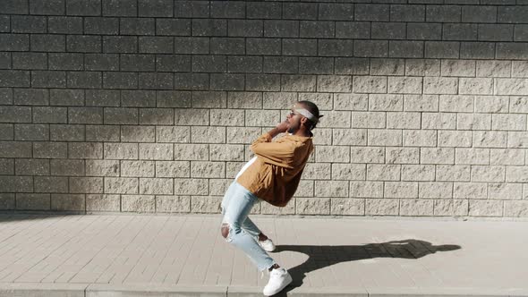Dance Loop of Talented Breakdancer Bending Backwards Moving Arms Having Fun Outdoors alt