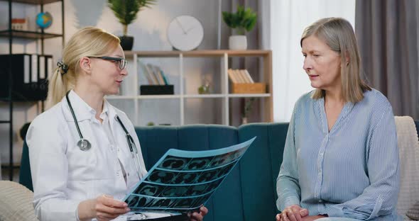 Doctor is Satisfied from Result of X-ray Scan of Patient and Giving High Five alt