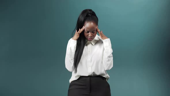 The Girl Squeezes His Eyes Tightly Showing Despair and Poor Health alt