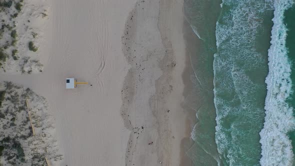 Aerial Drone Footage of Lifeguard Tower, Trigg Beach, Perth, Western Australia at sunset