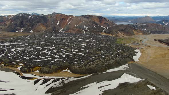Drone over Laugahraun lava field and Landmannalaugar rainbow mountains, Iceland alt