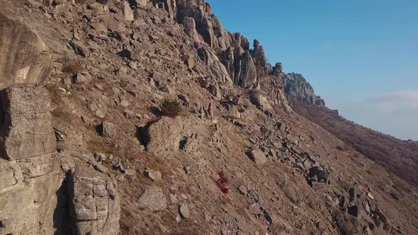 Aerial View of Mountain Range in Autumn Sun Beams and Glare Against the Top alt