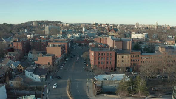 Aerial Drone Shot of Main Street in Suburban Boston Town at Dusk alt
