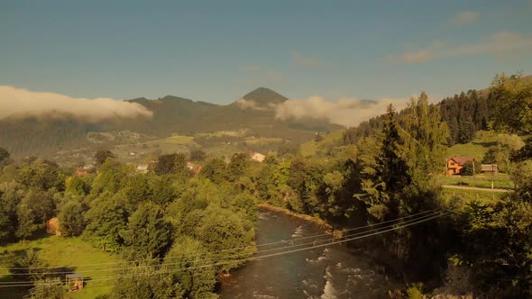 Foggy Sunrise Over Forests of Carpathian Mountains alt